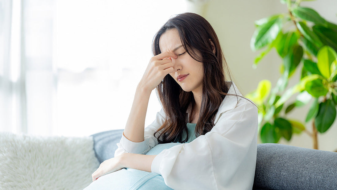 体調不良の女性